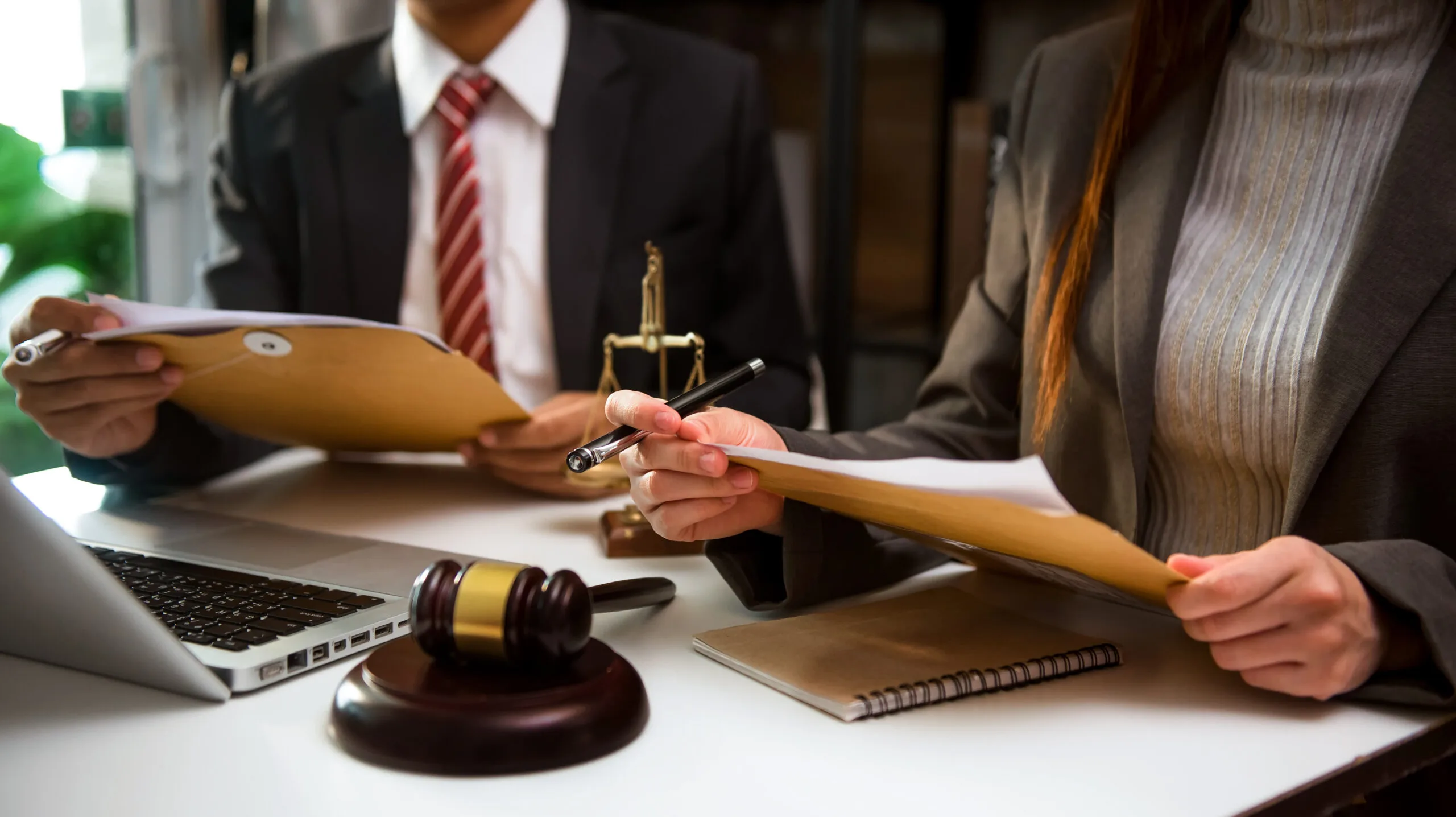 People holding documents in court